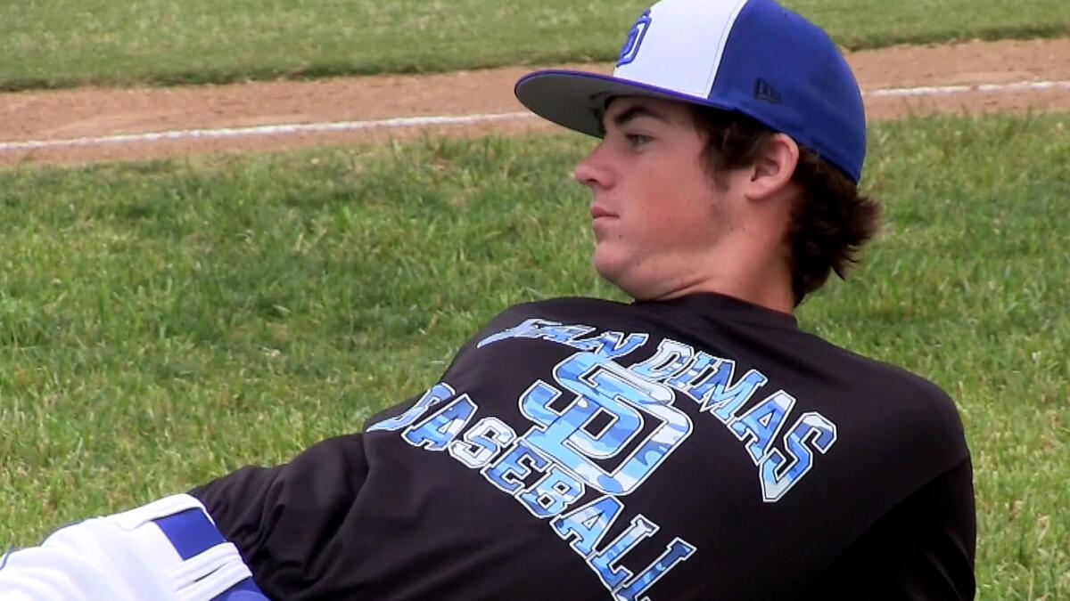 San Dimas pitcher Peter Lambert, loosening up before a game this season, had a record of 13-0.