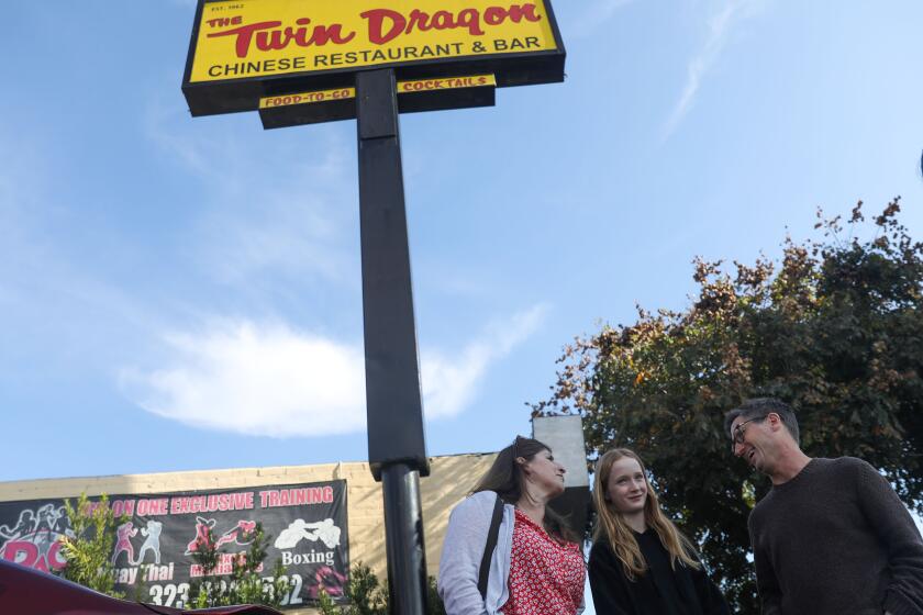 Los Angeles, CA - December 25: (From left) Allyn Woghin, 49, Lucy Gleim, 12, and Robert Gleim, 57, have dinner at Twin Dragon on Monday, Dec. 25, 2023 in Los Angeles, CA. (Michael Blackshire / Los Angeles Times)