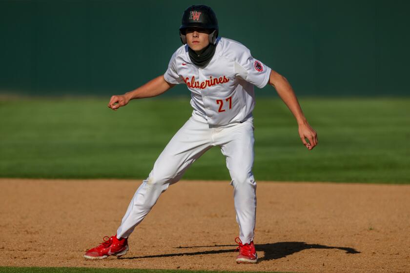 Encino, CA, Tuesday, March 23, 2021 - Harvard Westlake freshman Bryce Rainer leads off first base during a game against JSerra Catholic at O'Malley Family Field. Robert Gauthier/Los Angeles Times)