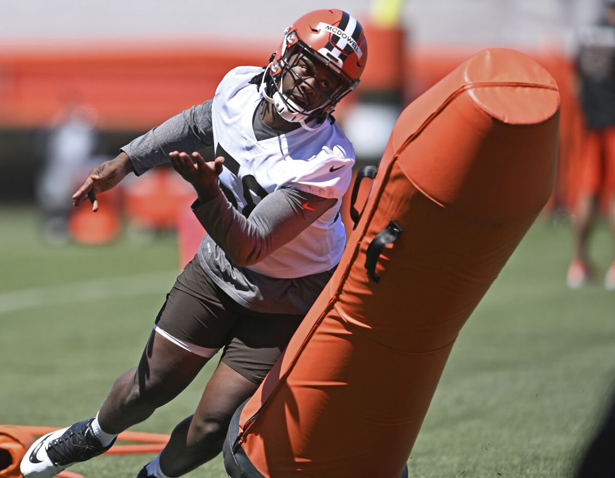 FILE - in this Thursday, June 17, 2021, file photo, Cleveland Browns defensive linemen Malik McDowell participates in a drill during NFL football practice at the team's training facility in Berea, Ohio. (AP Photo/David Dermer, File)