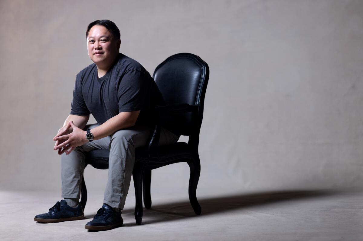  Liwei Liao sits in a chair