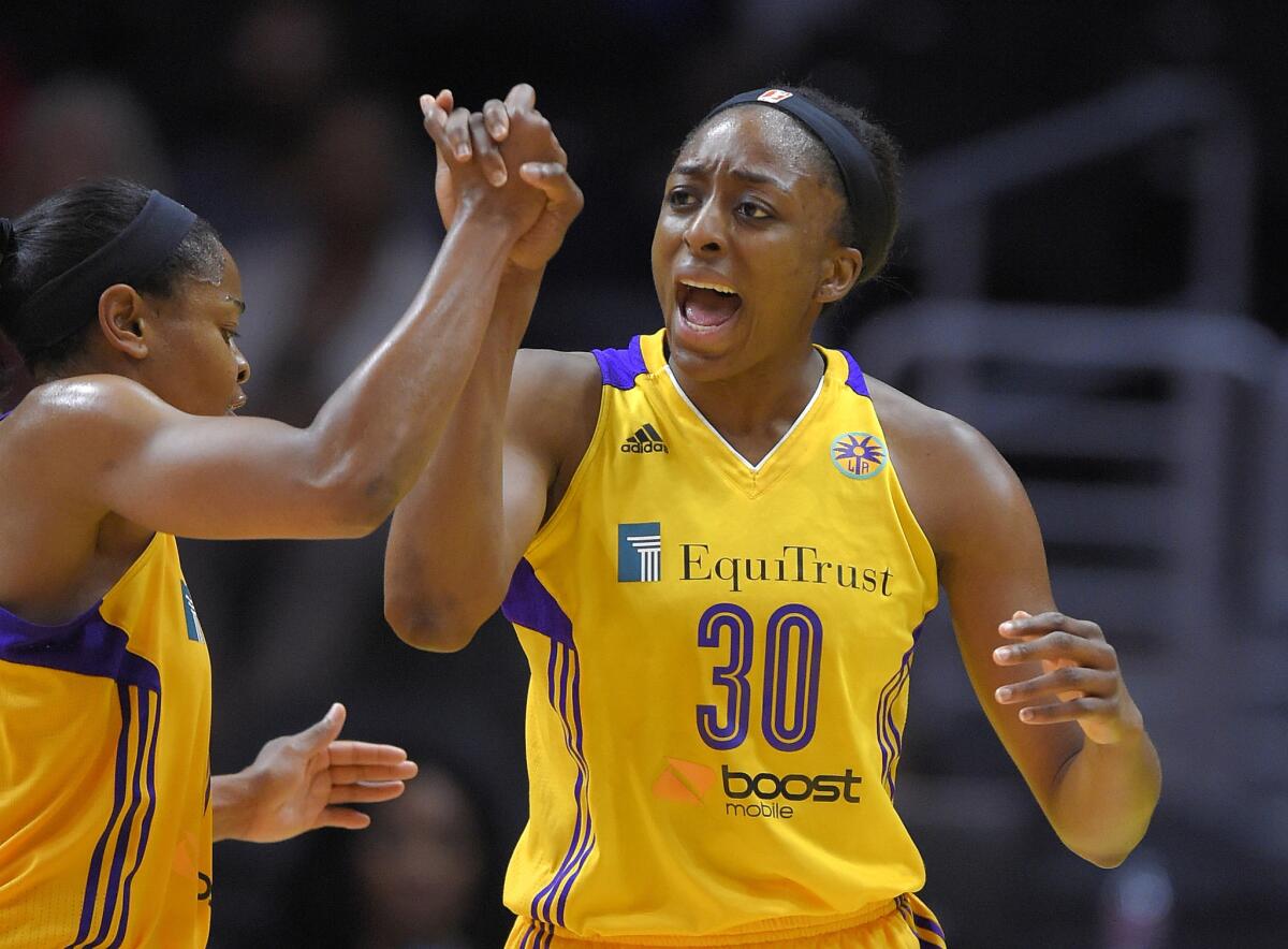 Sparks forward Nneka Ogwumike celebrates with guard Alana Beard during the second half of a game against the Tulsa Shock on Aug. 6.