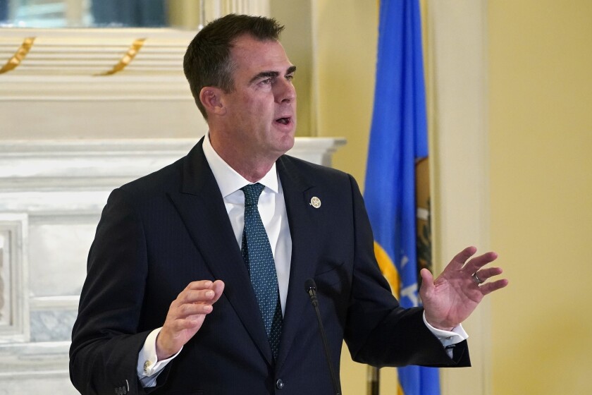 FILE - Oklahoma Gov. Kevin Stitt speaks at a news conference in Oklahoma City, April 29, 2022. Republican Stitt and Democratic challenger Joy Hofmeister have massive fundraising advantages over their opponents heading into the primary election, Tuesday, June 28, 2022. (AP Photo/Sue Ogrocki, File)