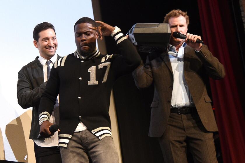 Director Etan Cohen, from left, Kevin Hart and Will Ferrell rev up the crowd at the SXSW premiere of "Get Hard."