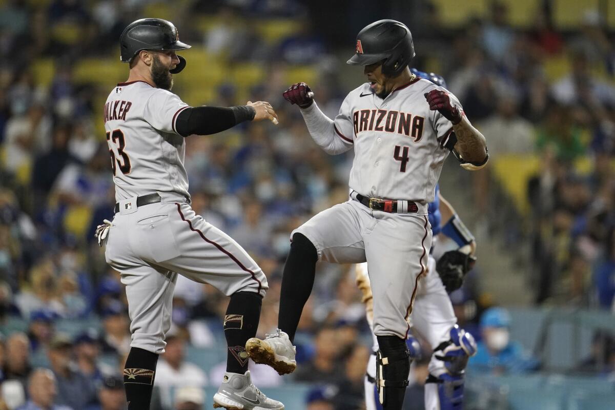 Arizona's Ketel Marte, right, celebrates his three-run home run with Christian Walker during the seventh inning.