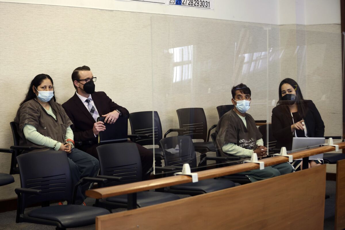 FILE - Yesenia Guadalupe Ramirez, far left, with attorney Cody Salfen and Jose Roman Portillo, third from left, with attorney Karri Iyama, appear for an arraignment hearing at the Santa Clara County Hall of Justice on Thursday, April 28, 2022, in San Jose, Calif. Santa Clara County Deputy District Attorney Rebekah Wise said Yesenia Ramirez and Jose Portillo were charged with three attempted kidnapping counts at a hearing Thursday, May 12, 2022. (Dai Sugano/Bay Area News Group via AP, Pool. File)