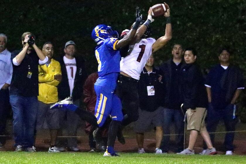 Oaks Christian wide receiver Michael Pittman catches the first of his five touchdown passes against Bishop Amat on Nov. 21.