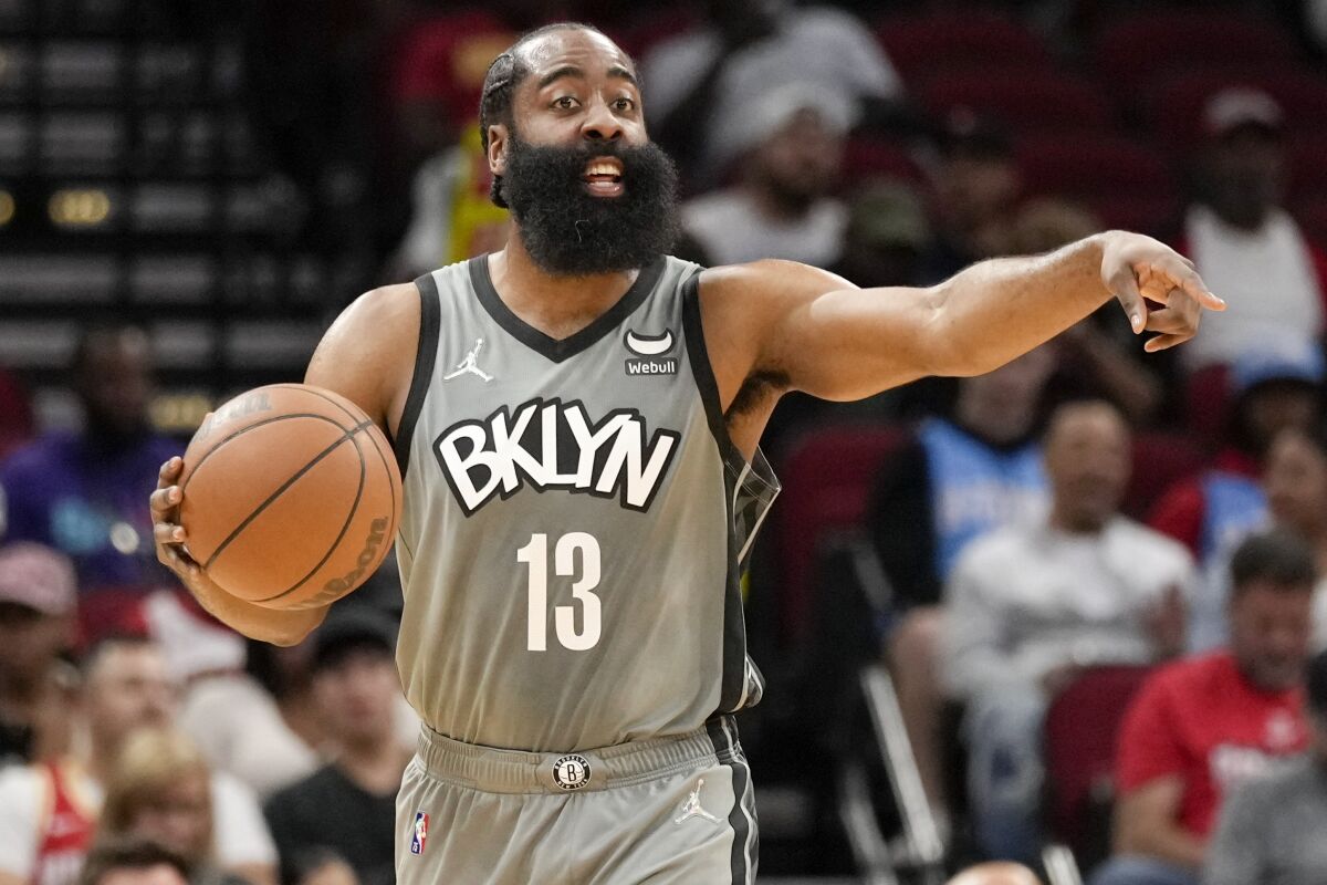 Brooklyn Nets guard James Harden gives instructions during the first half of an NBA basketball game against the Houston Rockets, Wednesday, Dec. 8, 2021, in Houston. (AP Photo/Eric Christian Smith)