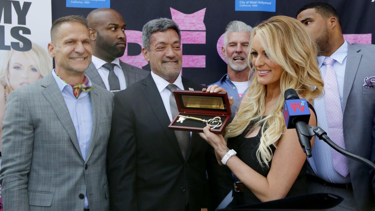 West Hollywood Mayor Pro Tem John D'Amico and Mayor John Duran present Stormy Daniels with a key to the city at Chi Chi LaRue's, a sex shop on Santa Monica Boulevard.