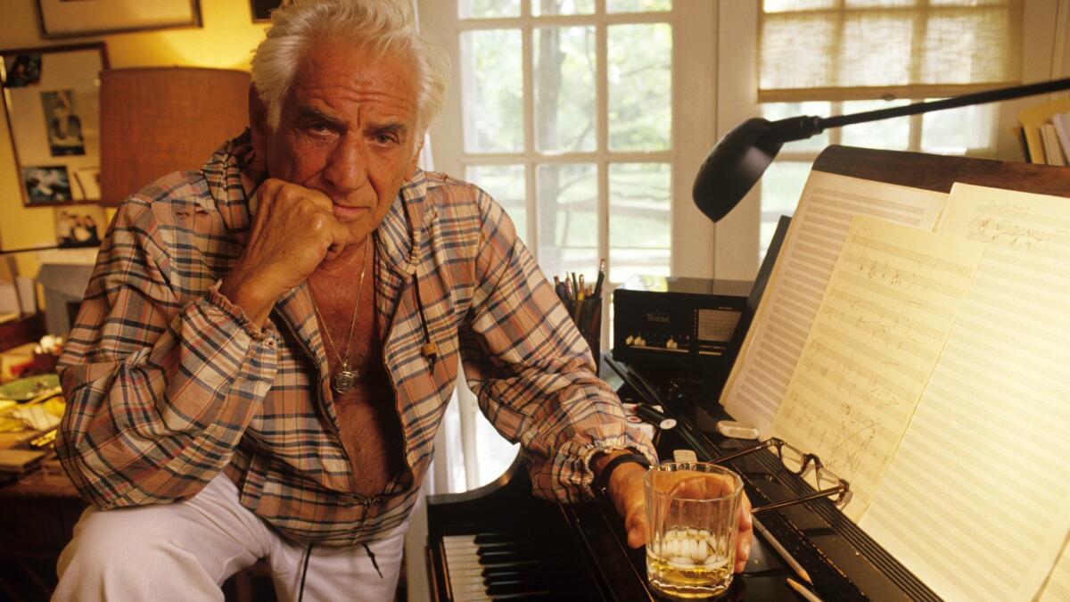 Composer Leonard Bernstein by the piano in 1986 at Springate, his home in Fairfield, Conn.