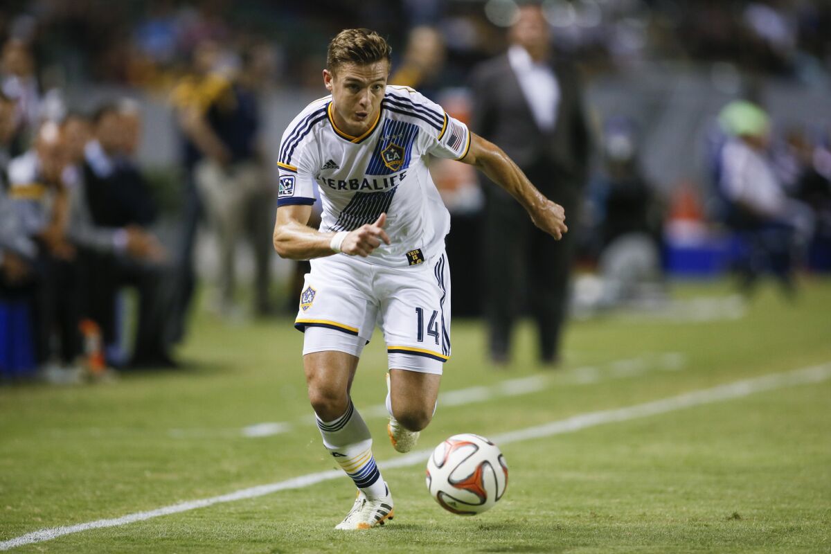 Los Angeles Galaxy's Robbie Rogers controls the ball against D.C. United on Aug. 27.