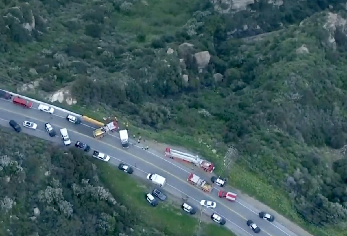 A large response by firefighters and police for a vehicle that went over the side of a canyon in Malibu 