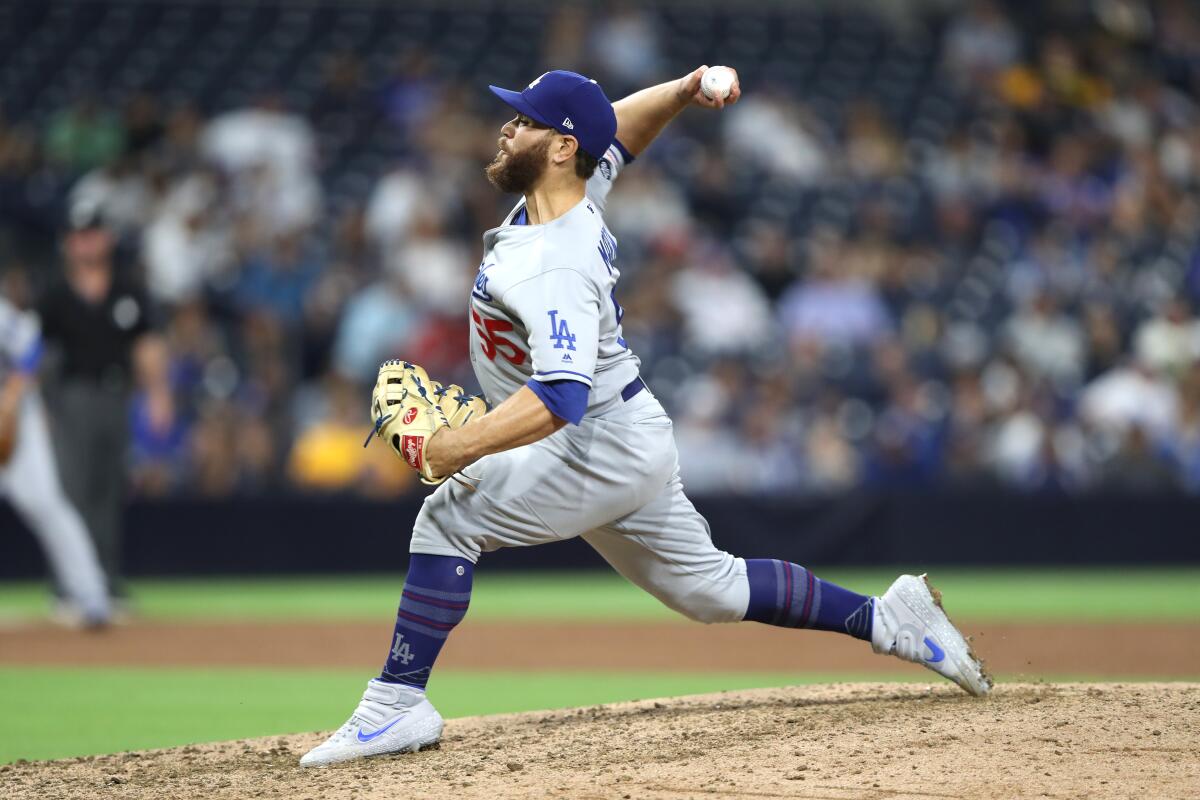 Russell Martin delivers a pitch in the ninth inning of the Dodgers' 9-0 victory over the Padres on Tuesday.