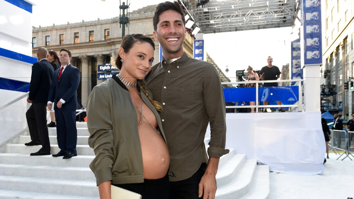 Laura Perlongo and Nev Schulman arrive at the MTV Video Music Awards at Madison Square Garden on Sunday.