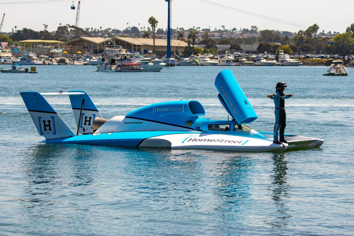 Jimmy Shane stands upon his hydroplane Miss HomeStreet after going for a test run last September.