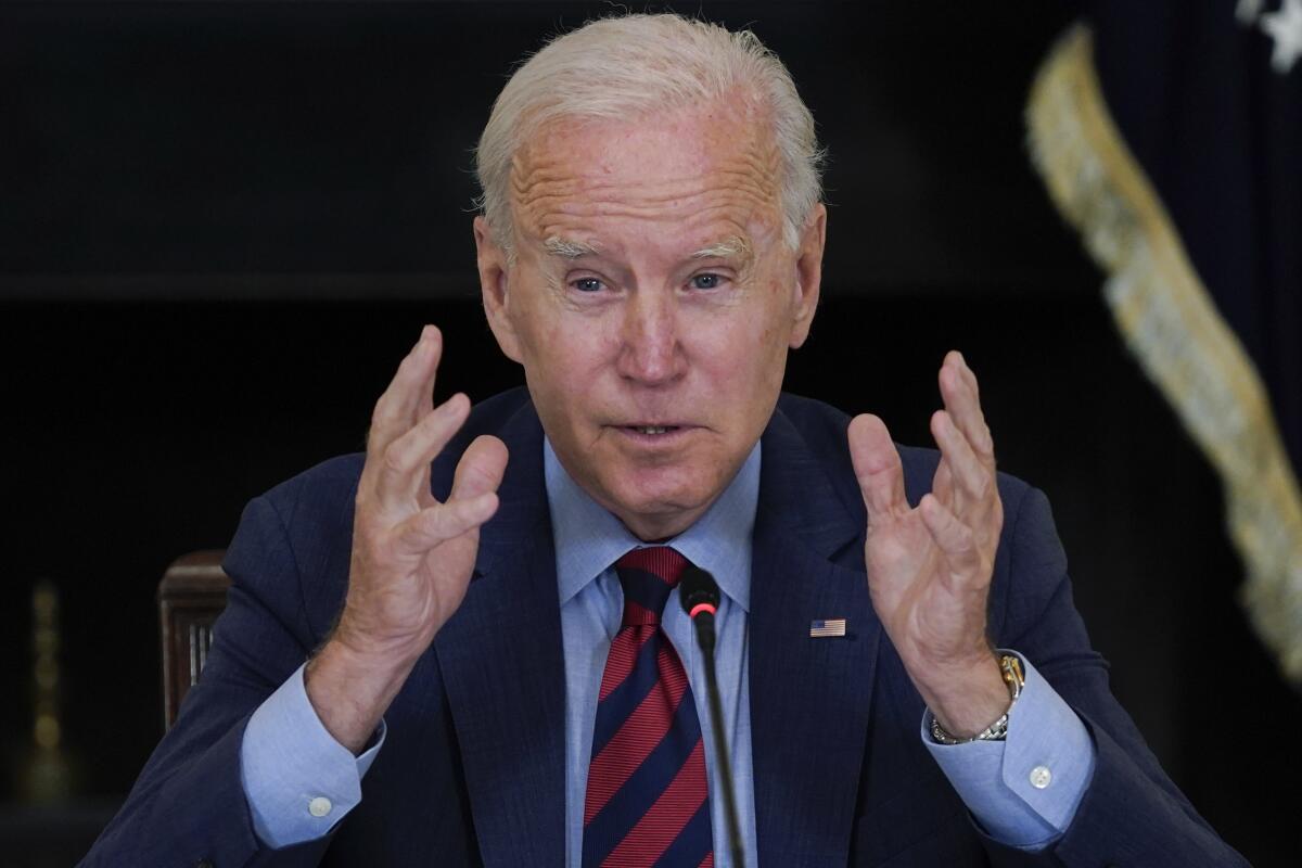 President Biden gestures while speaking