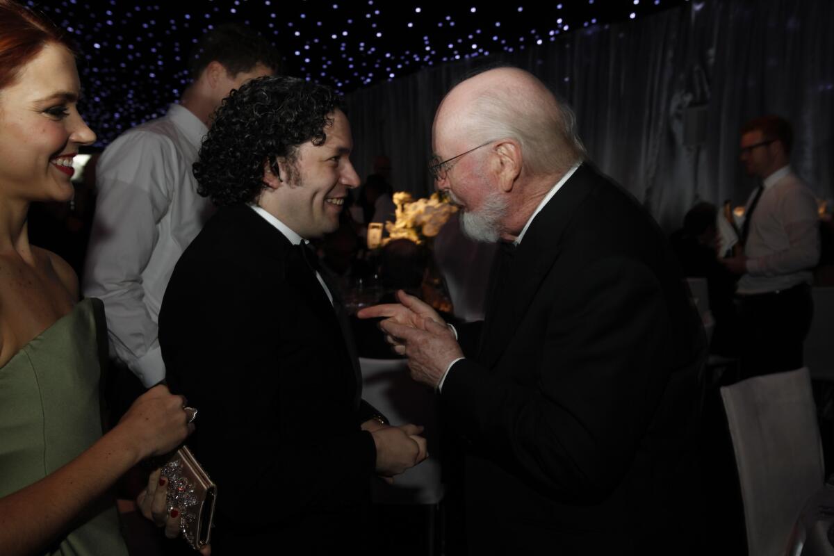 Gustavo Dudamel, left, speaking with composer John Williams at a 2013 gala held at Walt Disney Concert Hall.