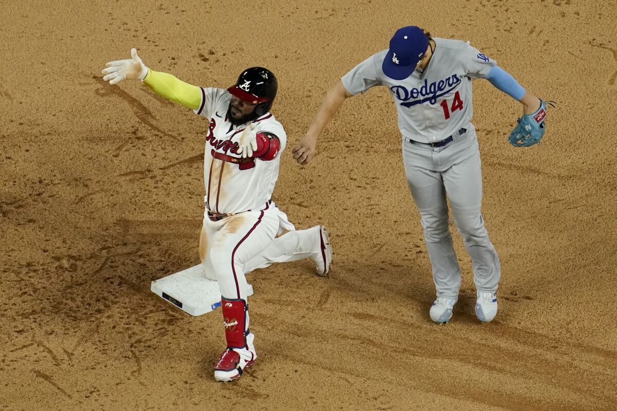 Atlanta's Marcell Ozuna celebrates after hitting a run-scoring double in the sixth inning.
