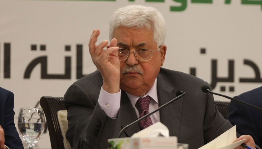 Palestinian President Mahmoud Abbas addresses a conference in the West Bank city of Ramallah on April 11.