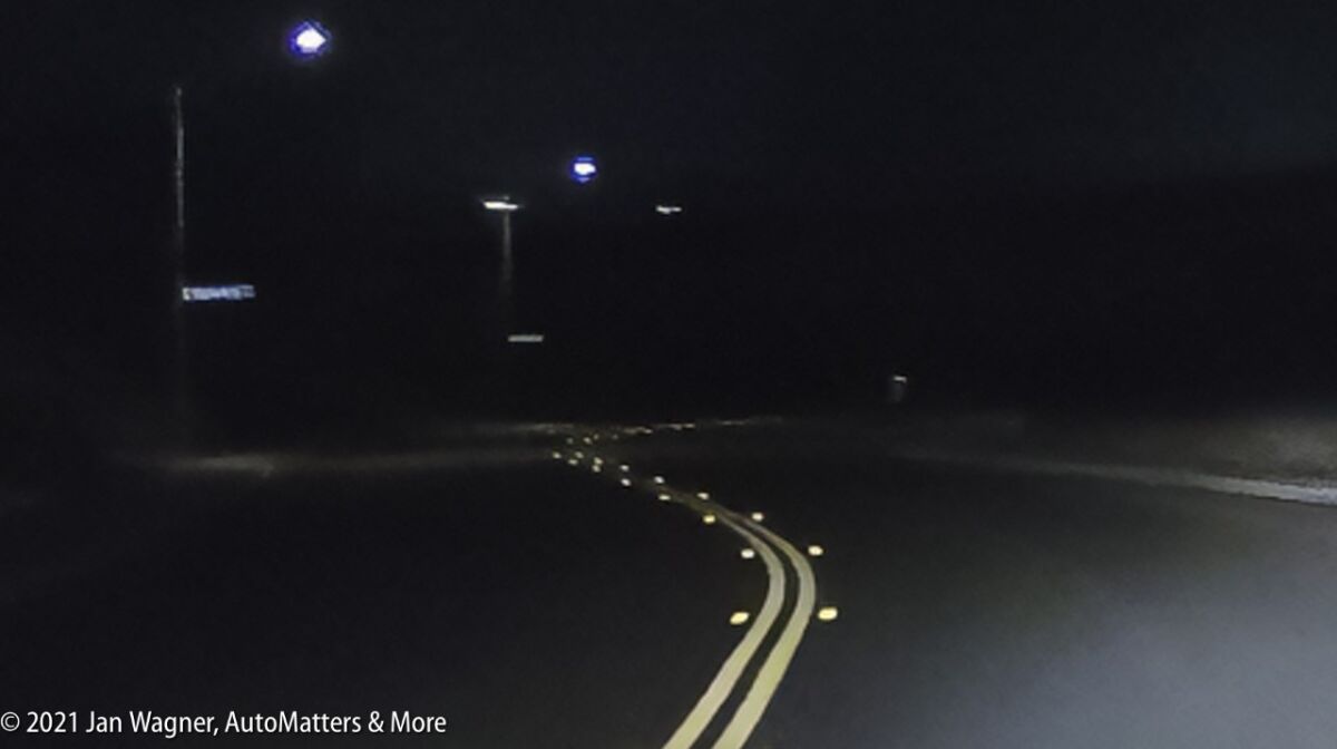 Left turn on a dark two-lane road