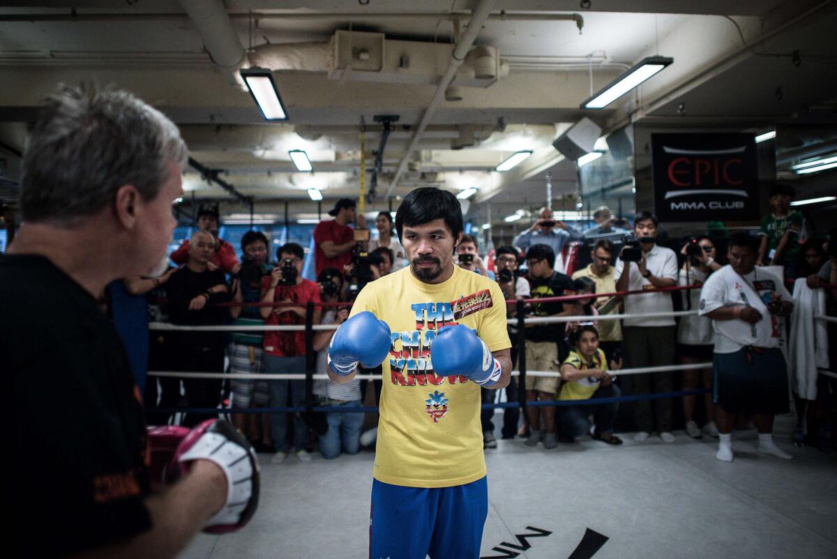 Manny Pacquiao takes part in a sparring session during a media call in Hong Kong on Oct. 27. Pacquiao (56-5-2, 38 knockouts) is set to face Chris Algieri (20-0, 8 KOs) on Saturday at the Venetian Macao.