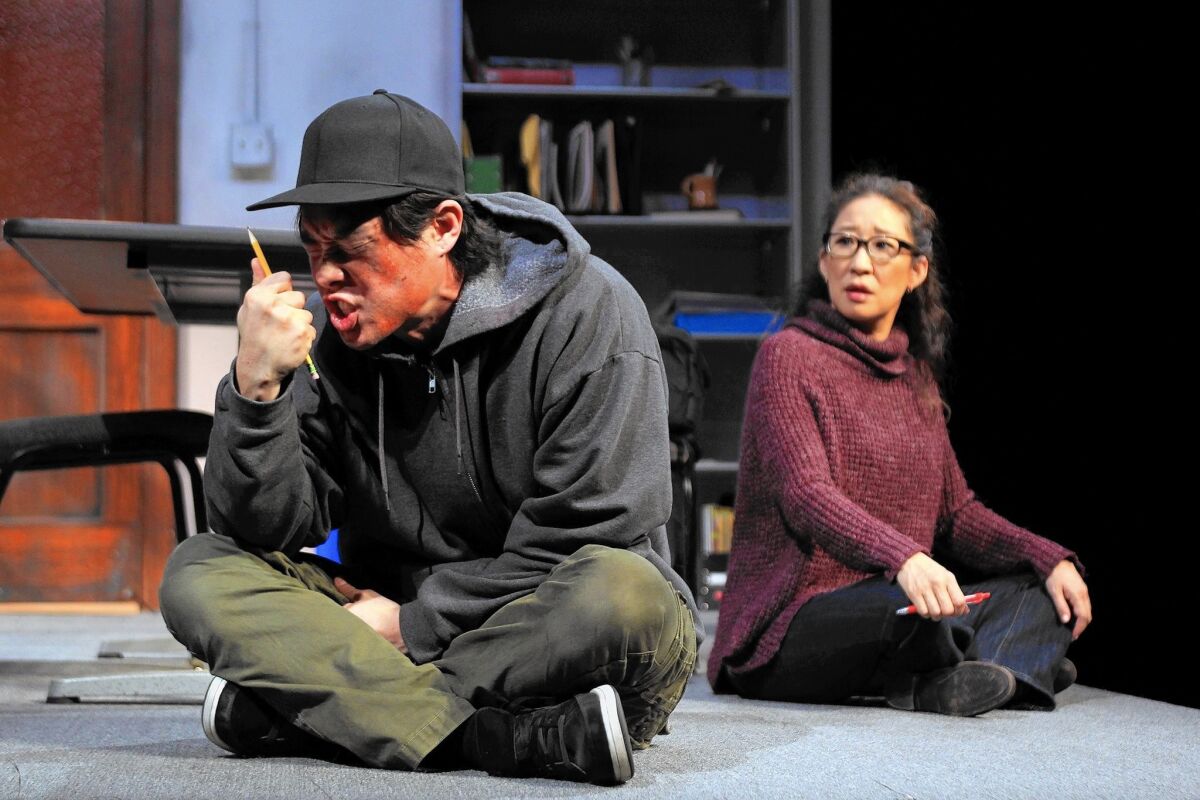 Raymond Lee and Sandra Oh in "Office Hour" at South Coast Repertory.