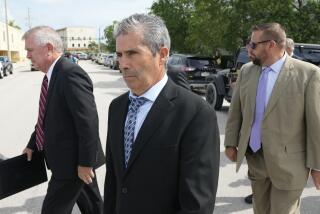 Carlos De Oliveira, center, property manager of former President Donald Trump's Mar-a-Lago estate, leaves the Alto Lee Adams Sr. U.S. Courthouse following his arraignment hearing, Tuesday, Aug. 15, 2023, in Fort Pierce, Fla. (AP Photo/Rebecca Blackwell)