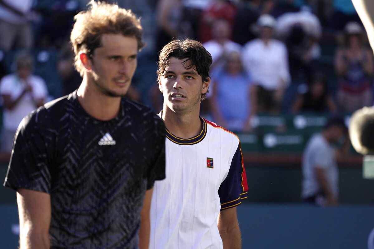 Taylor Fritz, right, follows Alexander Zverev off the court after Fritz's win at the BNP Paribas Open.