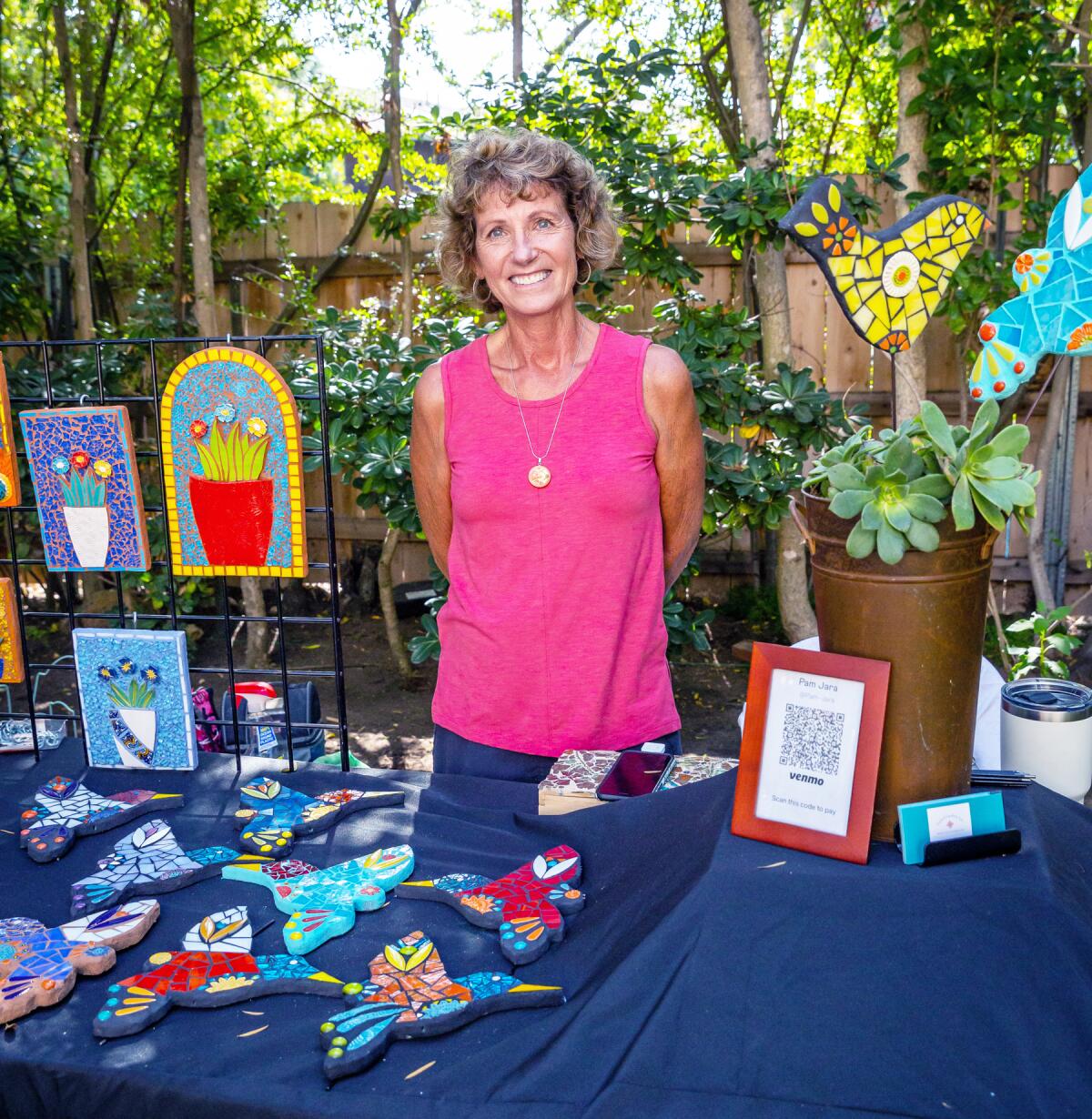 Artist Pam Jara with some of her artwork during the 2022 San Diego Coastal Art Studios Tour.