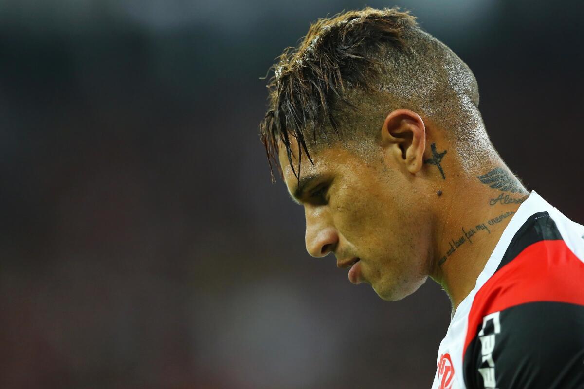 (FILES) In this file photo taken on April 27, 2017 Peruvian Paolo Guerrero (R) of Brazil's Flamengo gestures during the 2017 Libertadores Cup football match against Brazil's Paranaense at the Arena da Baixada stadium in Curitiba. Peru's Paolo Guerrero to miss World Cup over CAS doping ban, the CAS (Court of Arbitration for Sport) based in Switzerland announced on May 14, 2018.