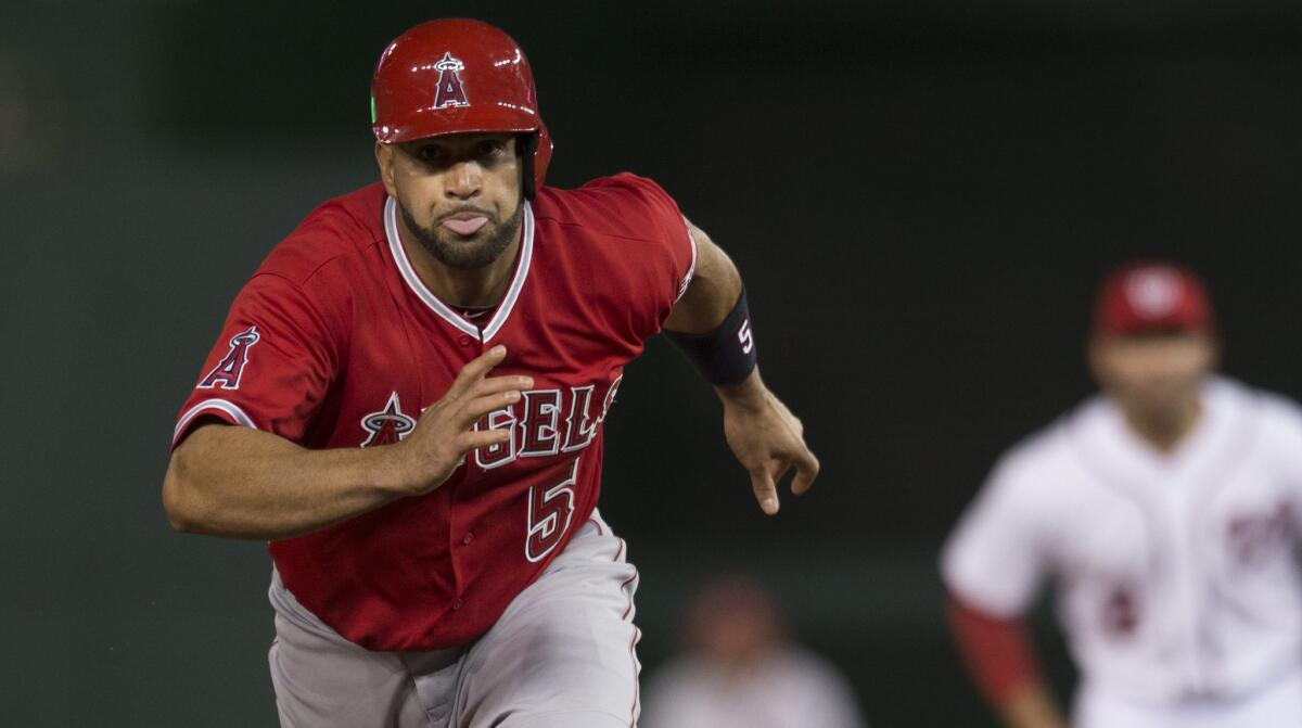 Angels slugger Albert Pujols runs to third base during the team's comeback victory over the Washington Nationals on Monday.