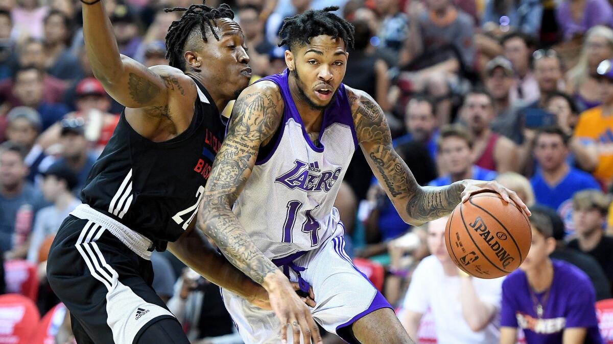 Lakers forward Brandon Ingram drives against Clippers forward Jaron Johnson during the Summer League opener on Friday night in Las Vegas.