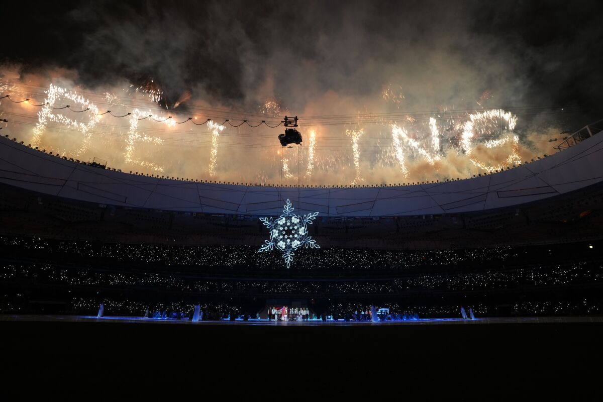 Fireworks ignite during the closing ceremony at the 2022 Winter Paralympics, Sunday, March 13, 2022, in Beijing. (AP Photo/Shuji Kajiyama)