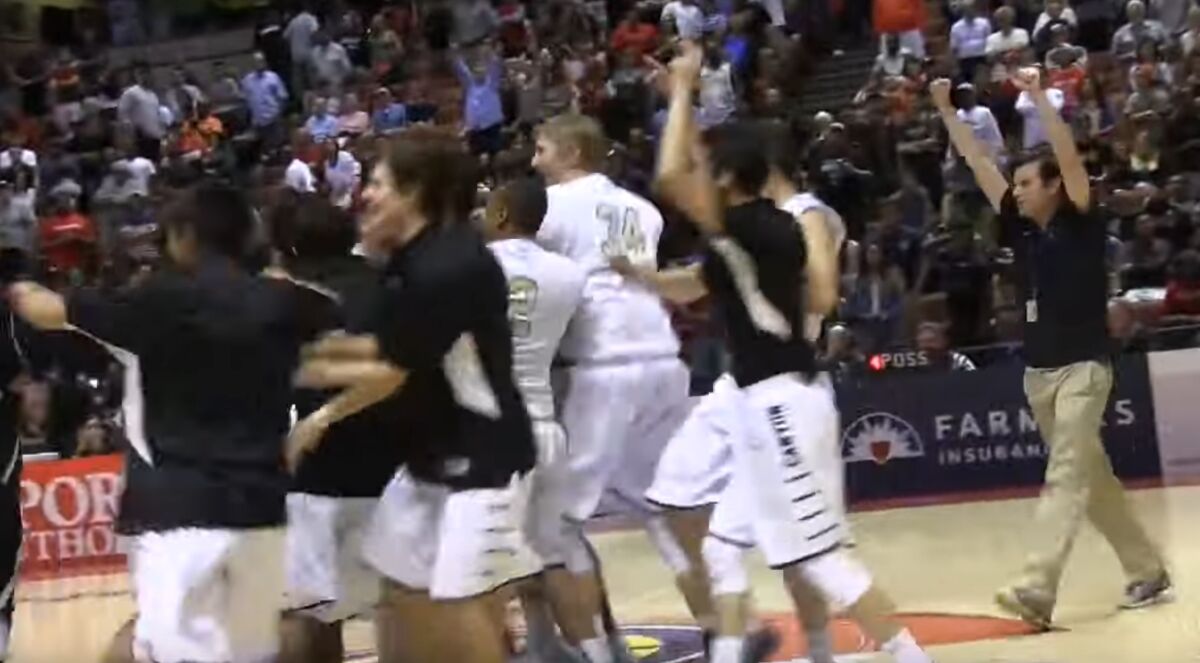 Anaheim Canyon players celebrate after rallying from a 22-point fourth-quarter deficit to defeat Lawndale, 103-98, in double overtime in the 2015 Division 2AA championship game.