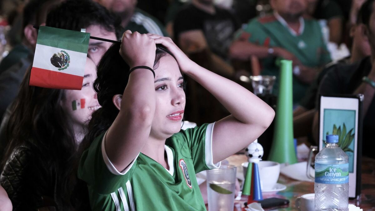 Mexico soccer fan Monse Maldonado reacts after Brazil scores during the World Cup match between Mexico and Brazil, at Guelaguetza Restaurant in Los Angeles on July 2, 2018. Telemundo has seen a boost from the matches with Mexico.