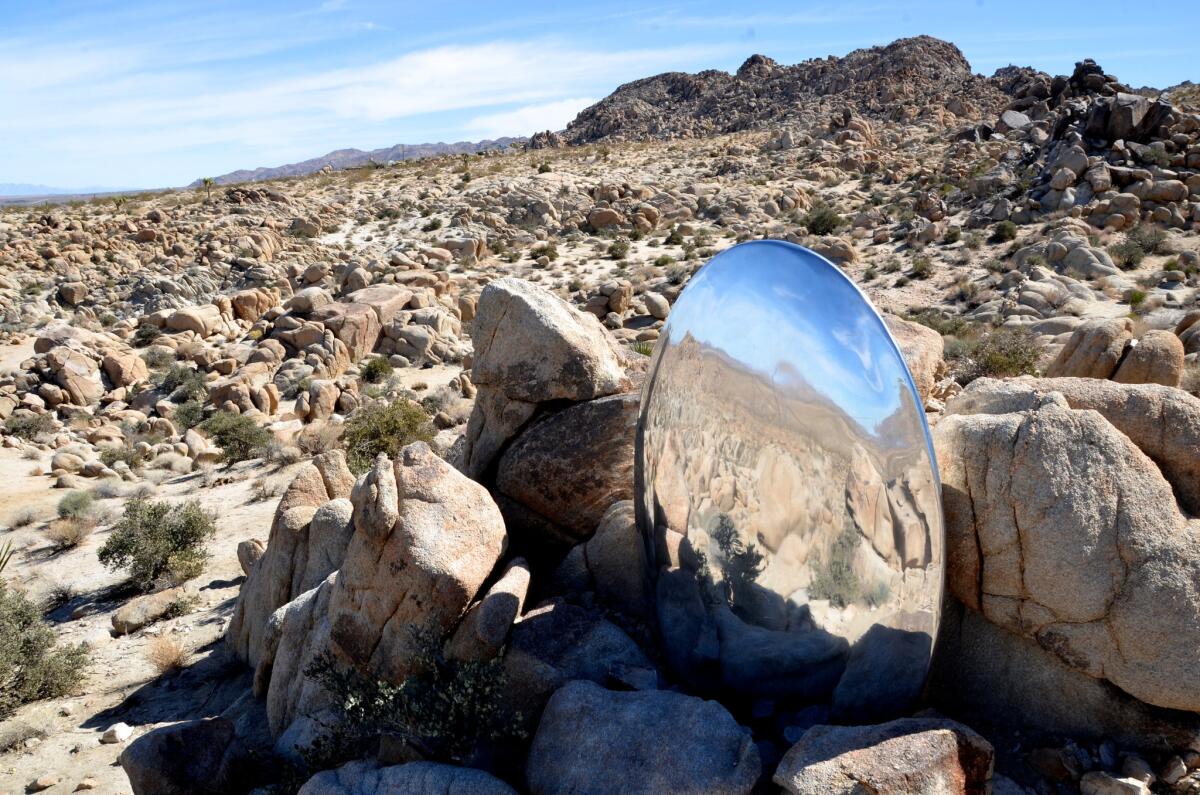 Sarah Vanderlip's aluminum sculpture "untitled" is nestled among the rocks outside Joshua Tree National Park.