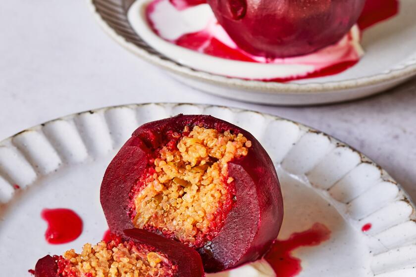 Quinoa-stuffed beets are served over a dollop of yogurt.