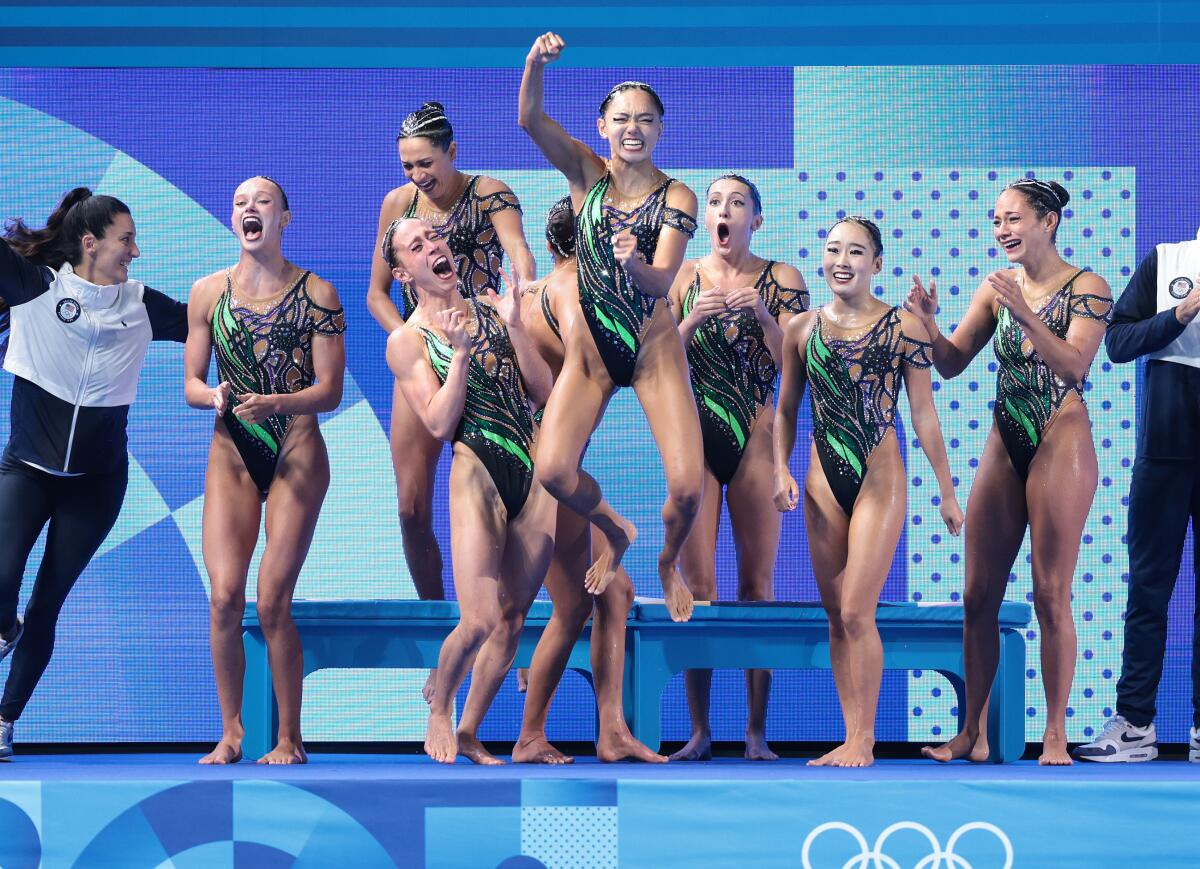 The U.S. artistic swimming team celebrates clinching the silver medal during the 2024 Paris Olympics Wednesday. 