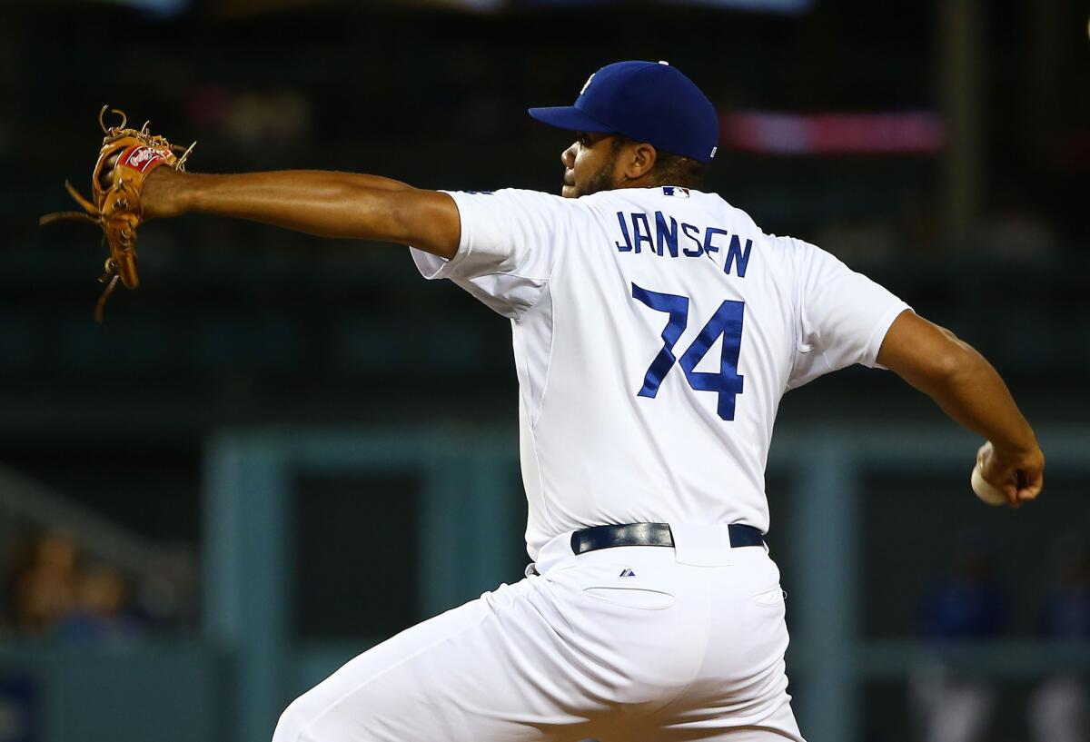 Dodgers closer Kenley Jansen pitches in the ninth inning against the Padres at Dodger Stadium.