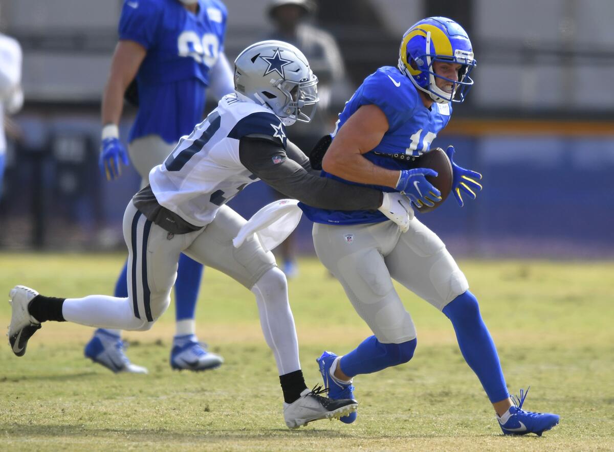 Dallas Cowboys cornerback Anthony Brown grabs Rams wide receiver Cooper Kupp on Aug 7, 2021.
