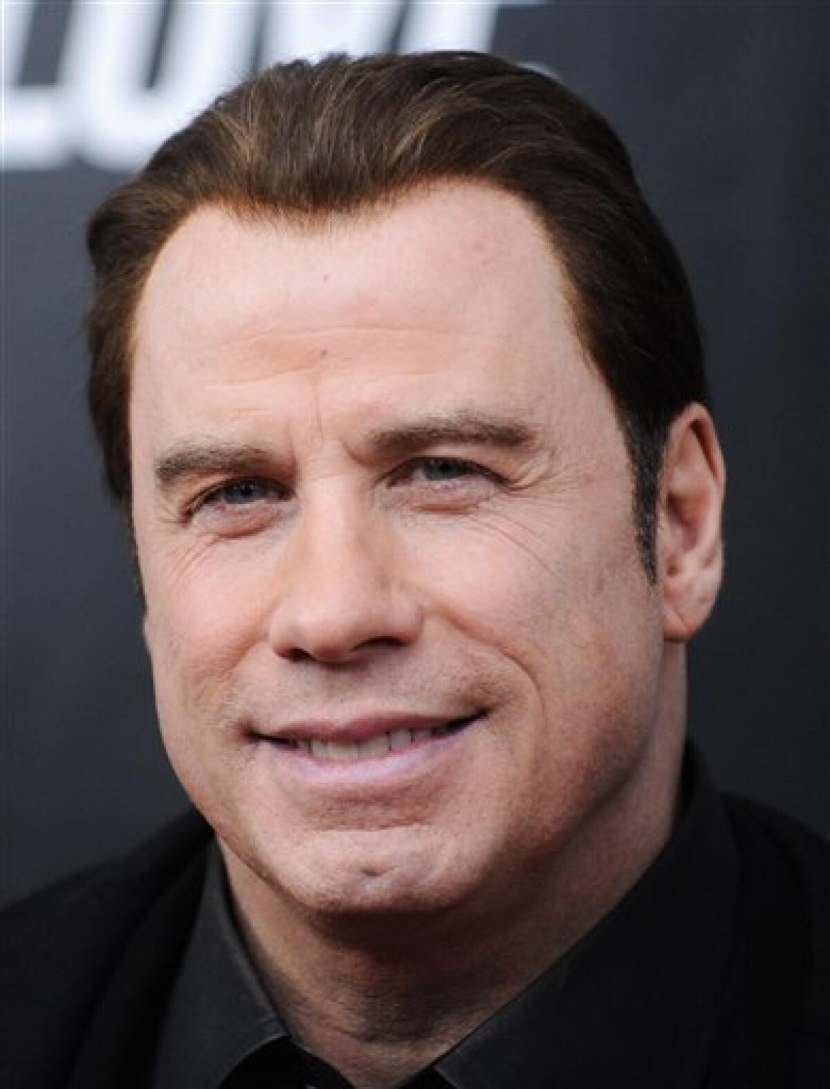 FILE - In this Jan. 28, 2010 file photo, actor John Travolta attends the premiere of "From Paris With Love" at the Ziegfeld Theatre in New York. (AP Photo/Evan Agostini)