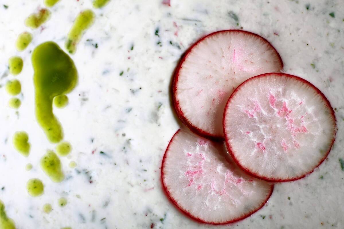 Buttermilk soup with a drizzle of green oil and radish slices hits the spot when the mercury soars. Recipe