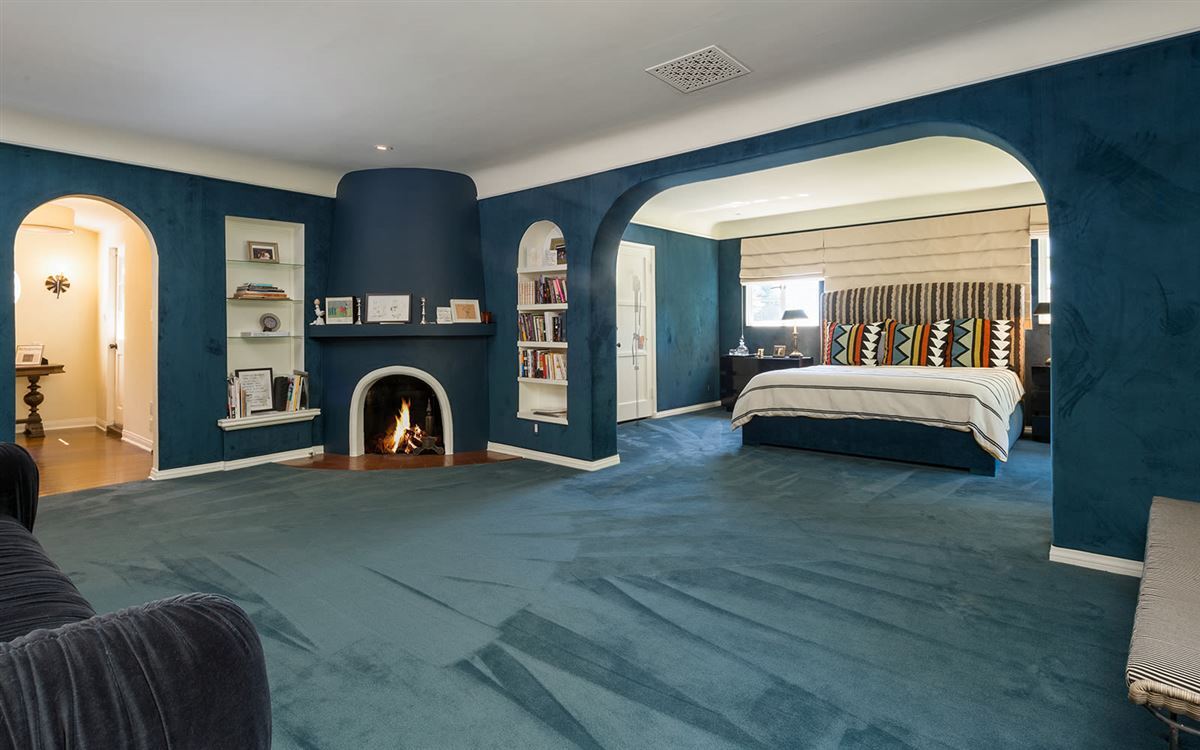 The master suite has a fireplace and a sitting room.
