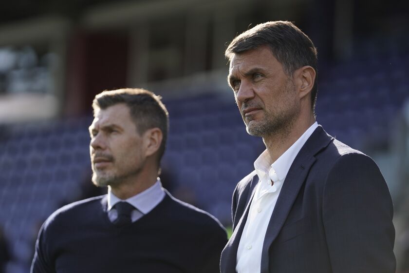 FILE - Paolo Maldini, right, and Zvonimir Boban look on during an Italian Serie A soccer match between Cagliari and Milan in Cagliari, Italy, on Jan. 11, 2020. Paolo Maldini’s tenure as AC Milan’s technical director has ended, the club announced in a brief statement Tuesday following reports of a rupture between Maldini and Milan’s new American owner, Gerry Cardinale. “AC Milan announces that Paolo Maldini concludes his role at the club, effective as of June 5, 2023,” the club statement said. (Spada/LaPresse via AP)