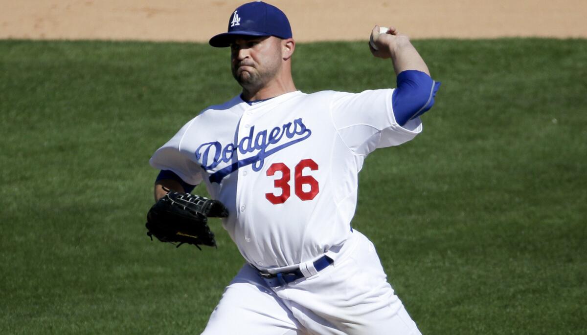 Adam Liberatore makes a relief appearance during an exhibition game on March 8.