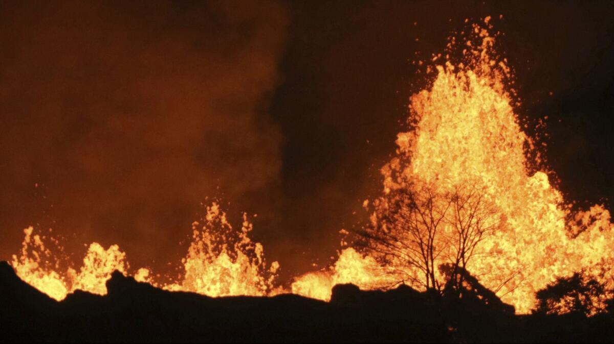 Lava from an open fissure on Kilauea volcano shoots high near Pahoa, Hawaii, in May. Hawaii Volcanoes National Park has now reopened after four months.