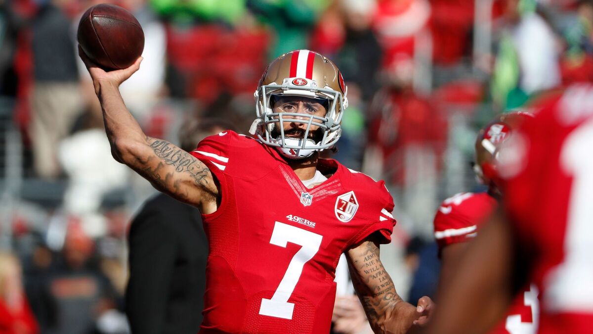 Colin Kaepernick warms up before the San Francisco 49ers' game against the Seattle Seahawks on Jan. 1.