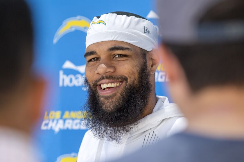 Los Angeles Chargers wide receiver Keenan Allen smiles during a news conference after drills at the NFL football team's practice facility in Costa Mesa, Calif., Wednesday, June 1, 2022. (AP Photo/Alex Gallardo)