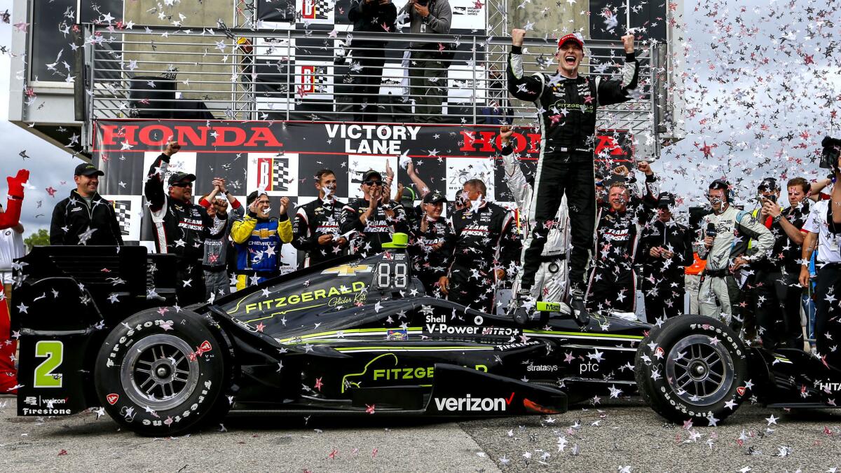 Josef Newgarden celebrates after winning the Indy Grand Prix of Alabama on Sunday.