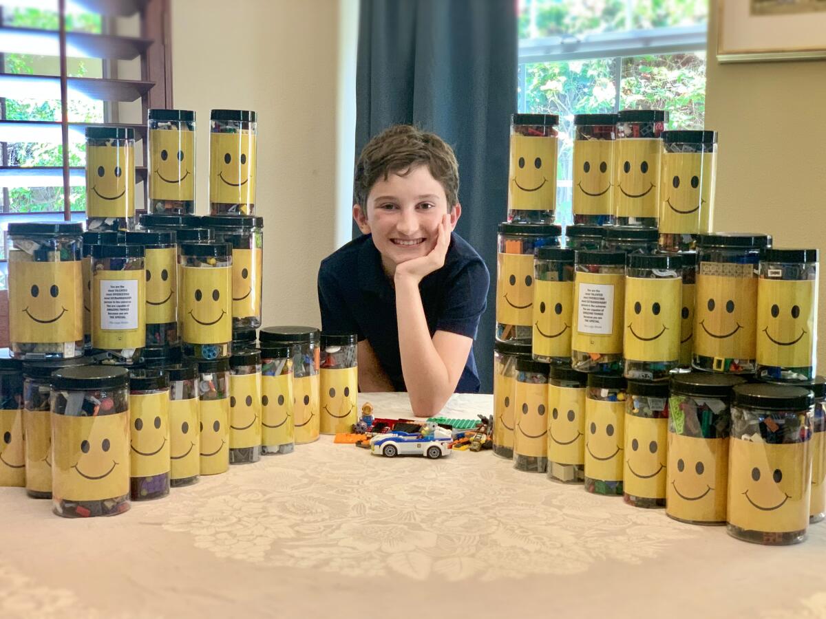 Alexander Fullerton with his Lego donations.